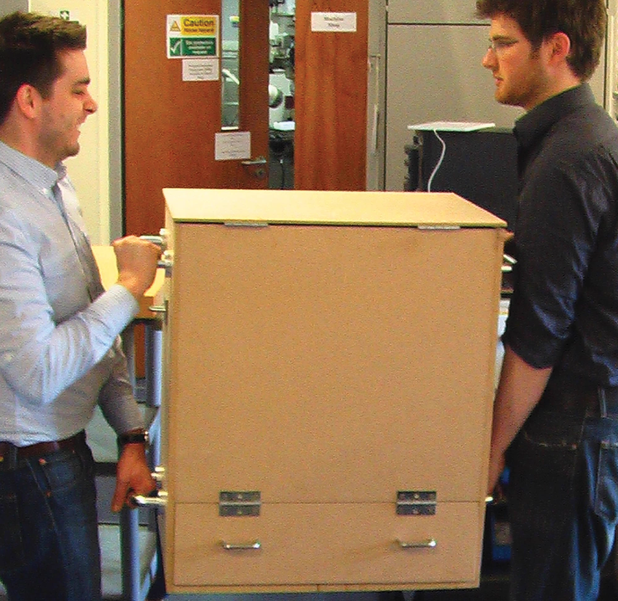 Carrying a cardboard mock-up through a doorway