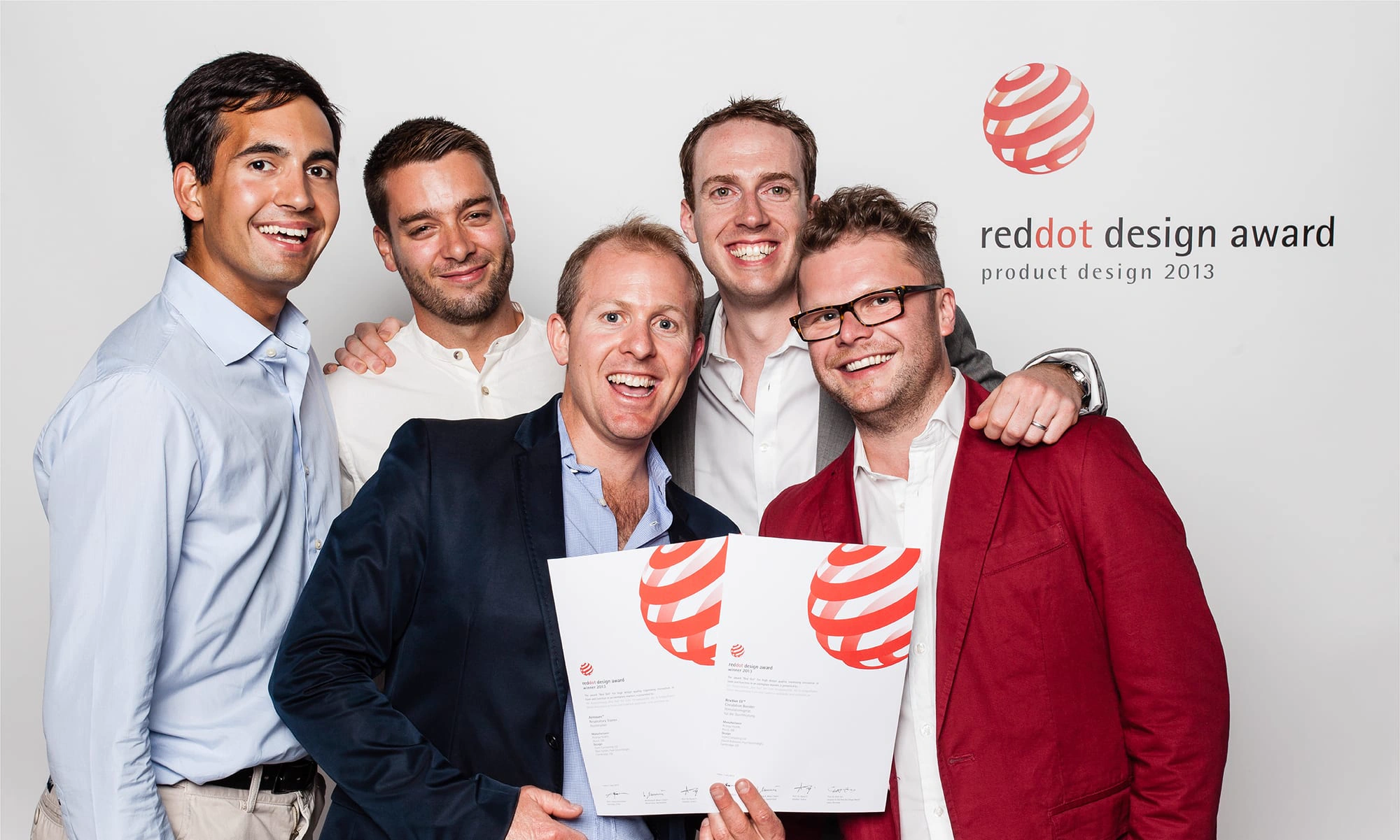 The team receiving the 2013 Red Dot award